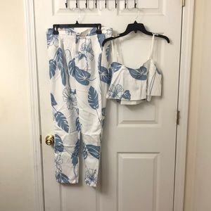 Blue two piece outfit. Crop top and pants.